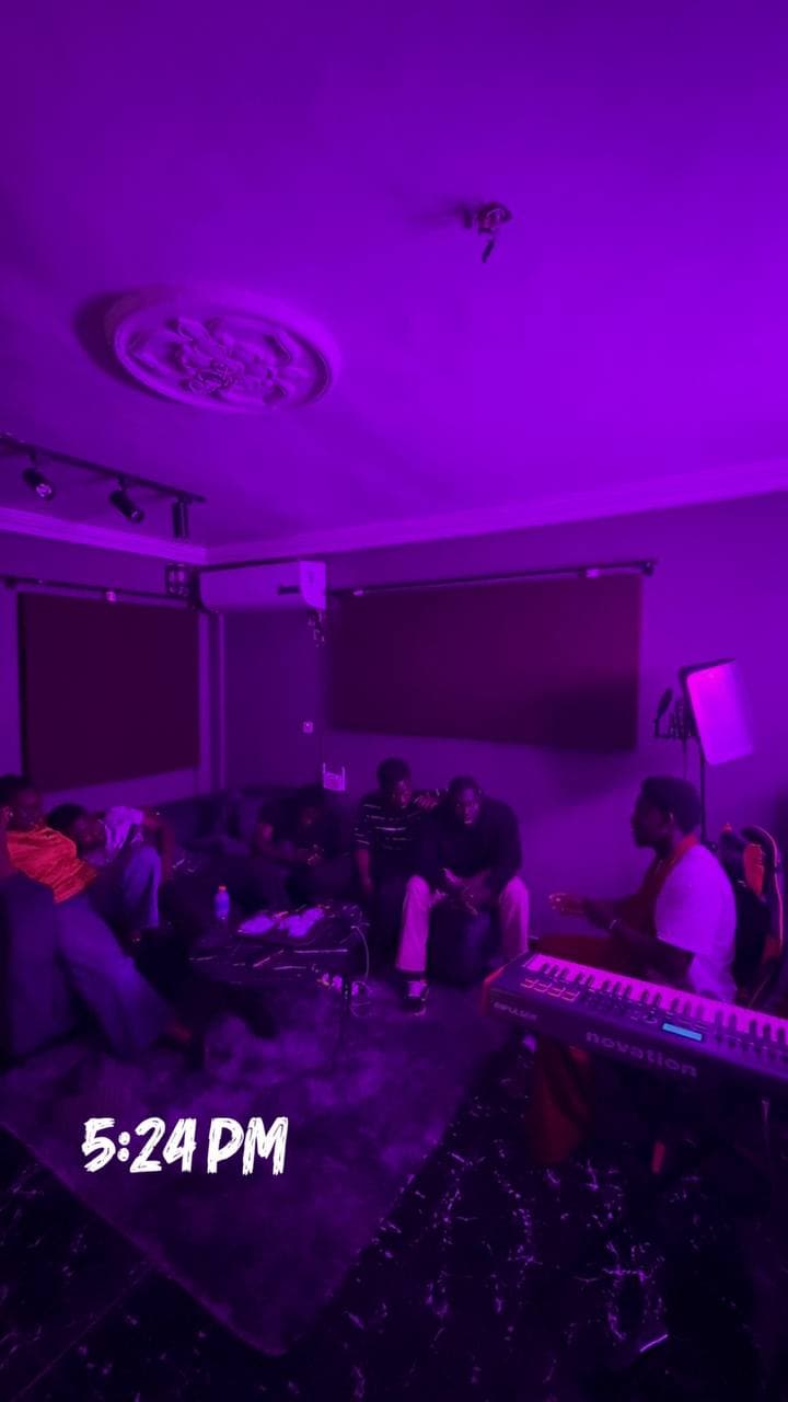 A group seated in the lounge, with “5:24 PM” written across the photo