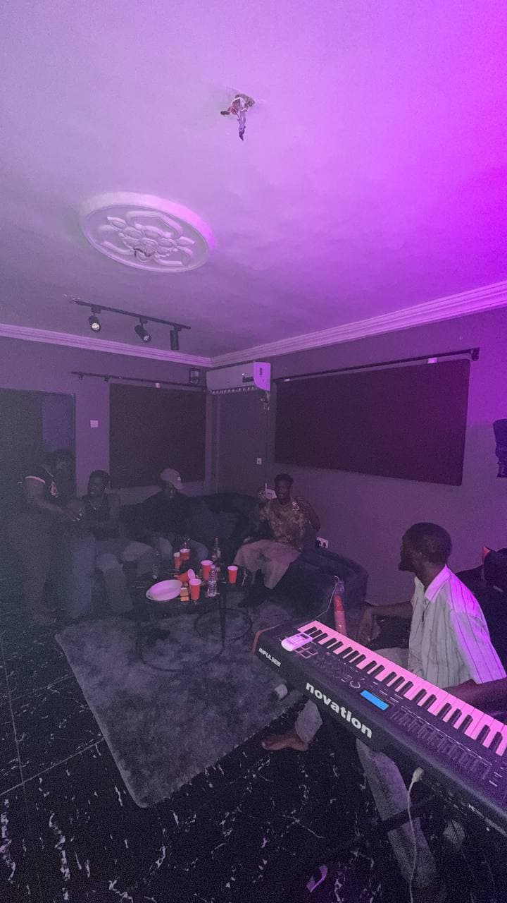 A group gathered in the lounge with drinks